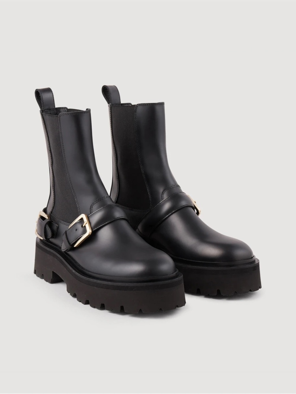 Sandro Black Leather Lug-Sole Chelsea Boots with Gold Buckles